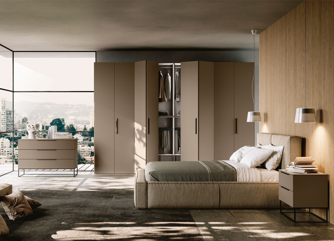 Immagine con camera da letto con armadio ante a pacchetto e grande letto in tessuto